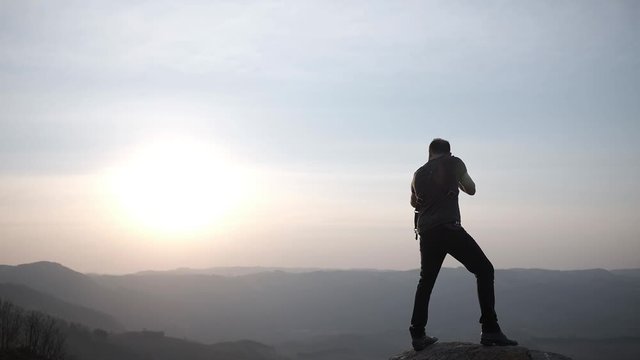 Photographer at sunset with camera