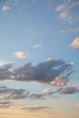 Amazing dark grey and white clouds during the sunset contrasted against a lighter color sky