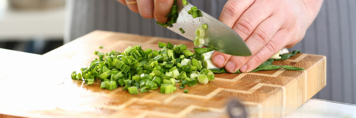 Chef Hands Holding Knife Cutting Green Onion