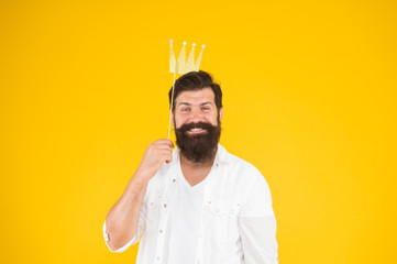 smiling happy king. brutal bearded man king. Costume party. happy birthday. hipster booth props yellow background. ready for fun. bearded man party crown. king of party. royal style