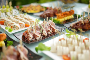 The classic Spanish hamon. Food delivery service and catering meals on the table during the event.
