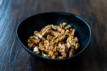 Walnut Kernels and Whole walnuts in Porcelain Bowl.
