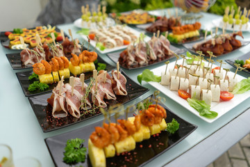 The classic Spanish hamon. Food delivery service and catering meals on the table during the event.