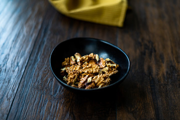 Walnut Kernels and Whole walnuts in Porcelain Bowl.