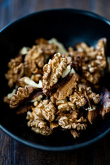 Walnut Kernels and Whole walnuts in Porcelain Bowl.