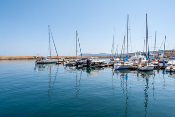 Fototapeta na wymiar Fishing boats near the pier in the port of Chania