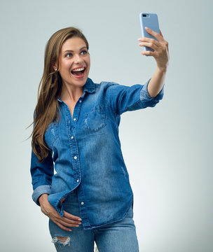  happy woman in cassual style makes selfie, self portrait.