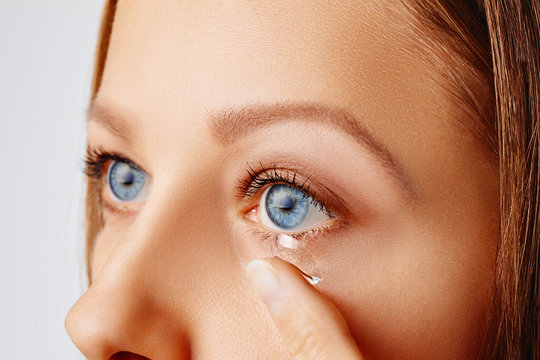 Young Woman Puts Contact Lens In Her Eye. Eyewear, Eyesight And Vision, Eye Care And Health, Ophthalmology And Optometry Concept