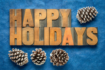Happy Holidays greetings in wood type