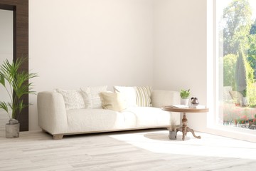 Stylish room in white color with sofa and summer landscape in window. Scandinavian interior design. 3D illustration