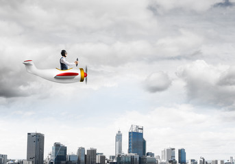 Businessman in aviator hat and goggles