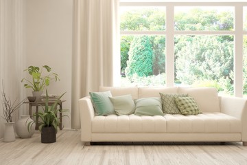 Stylish room in white color with sofa and summer landscape in window. Scandinavian interior design. 3D illustration