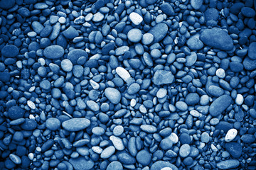 Fototapeta na wymiar Beach Pebbles Background blue toned