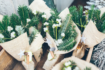 Image of a traditional Christmas bouquet on a wooden surface in a outdoor Christmas market....