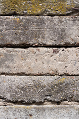 Old concrete blocks wall background closeup