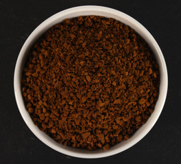 cup of instant coffee on black background