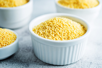 Dried millet porridge in the white bowl