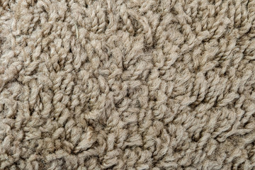 Texture of wool carpet light brown color