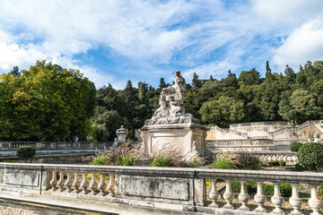 Obraz premium Stone monuments and sculptures decorating the Fountain Gardens in Nimes, Provence, France