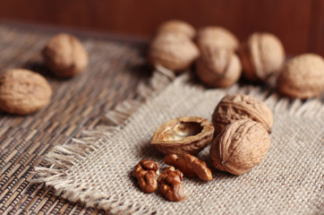 Walnuts isolated on the brown background 