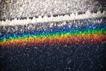 Colors of the rainbow on a morning frosted surface of fractal cristals, the spectrum of the light...