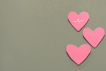 Love hearts on blue isolated background. Valentines day card concept.Three Hearts for Valentines Day Background.one of them shows an electrocardiogram