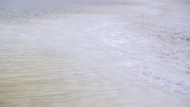 A shore of the Bascunchak salt lake with a largest reserve of salt in the world