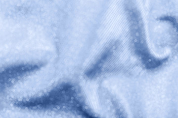 Abstract blurred sparkle bakground in blue color.