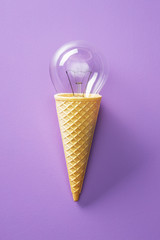 Classic light bulb in ice cream cone.
