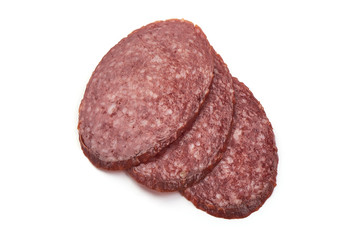 Dried pork sausage slices, isolated on white background