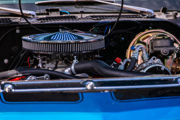 blue classic muscle car under hood close up, big chrome round air intake filter, Engine and...