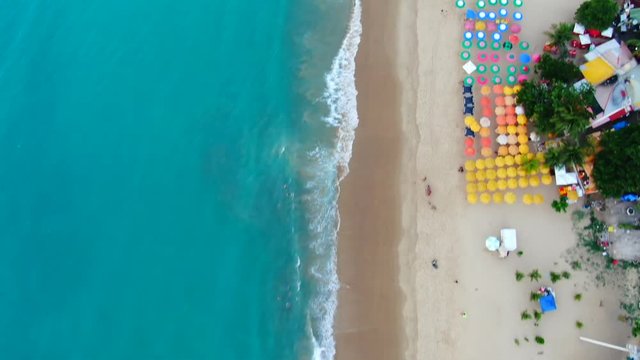 Aerial view of beach in Fortaleza. Luxury resorts and hotels, skyscrapers on the coast line. Amazing sand, bars, restaurants. Side motion of the dron. 