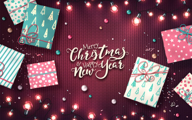 Fototapeta premium Christmas and new year banner with gift boxes, xmas garlands of lights, baubles and glitter confetti on purple knitted texture. Horizontal holiday background with glowing LED light bulbs. Vector