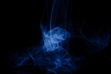 Blue neon intertwined smoke. Isolated on black background. Color of the year 2020 concept. Abstract black background. Neon lights texture.