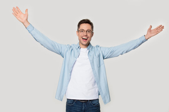 Overjoyed Happy Man Standing With His Hands Wide Open