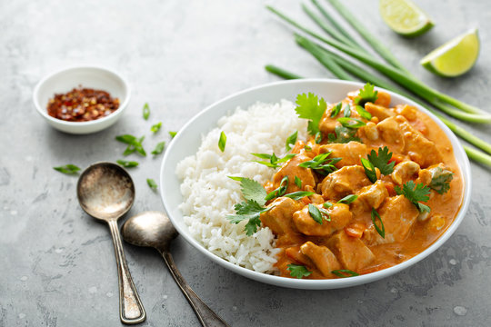Chicken and cashew red curry with rice and herbs, thai inspired dish