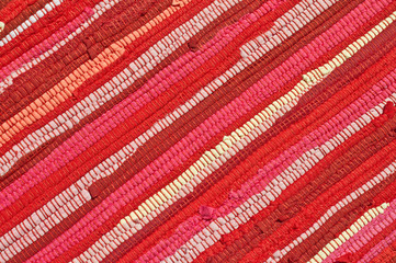 detail of red rug with diagonal lines