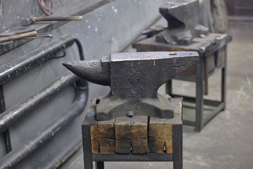 Heavy metal anvil in the forge for forging handmade products