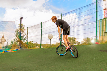 bmx bicycle rider tricking. Extreme BMX rider. Boy jump in skatepark on competition. Sport bicycle...