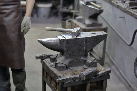 Heavy metal anvil in the forge for forging handmade products