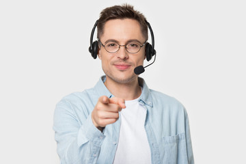 Smiling European man in glasses wearing headset with microphone.