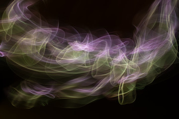Fototapeta premium Chaotic movement of different bands on a black background