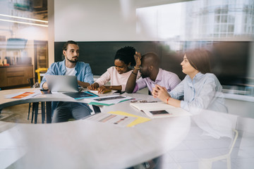 Employees working in meeting room