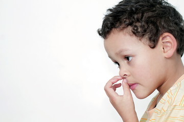 boy picking his nose and having fun with white background stock photo