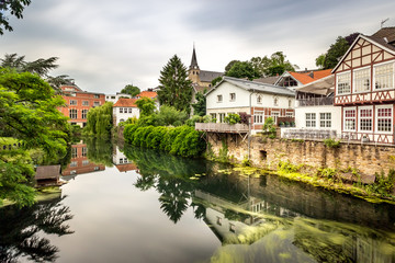 Fototapeta na wymiar Kettwig, Germany - Long Exposure of Traditional Houses and Water Front in the Peaceful and Quiet German Town of Kettwig