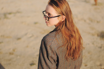 Young hipster girl posing outdoors, outdoor fashion portrait, sunglasses, street style, red lips...