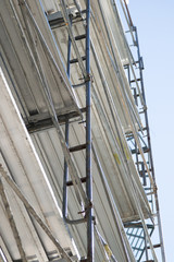 Naklejka premium Construction scaffolding on a building facade
