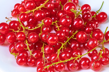 Fresh washed berries of red currant on the background