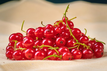 Fresh washed berries of red currant on the background