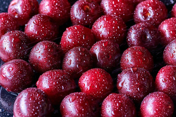 Fresh washed cherry berries with water drops on a background
